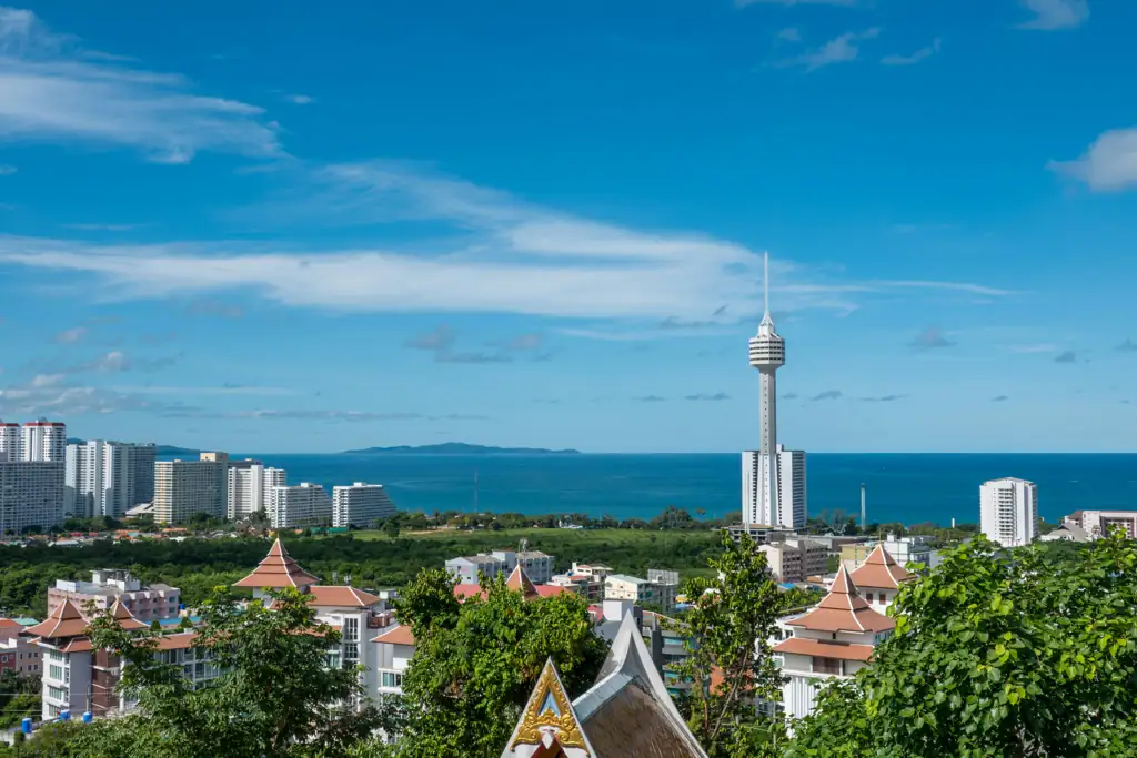 Pattaya Bay seen from a hillside, with high-rise buildings, Pattaya Park Tower and the sea